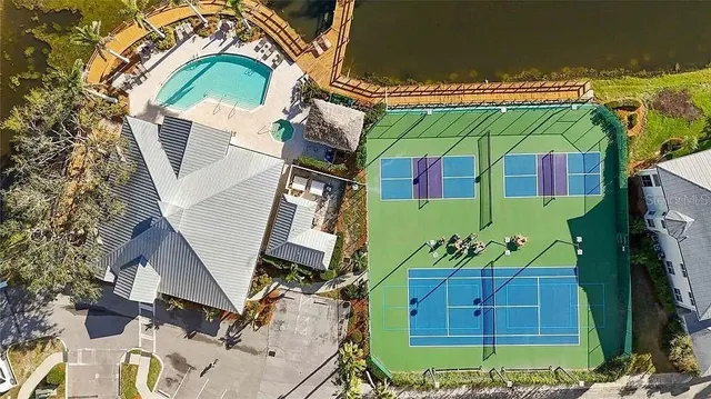 an aerial view of a chairs and table