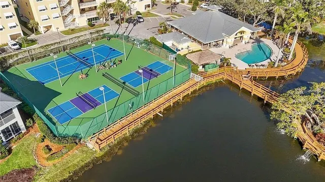 an aerial view of a pool patio swimming pool and outdoor seating