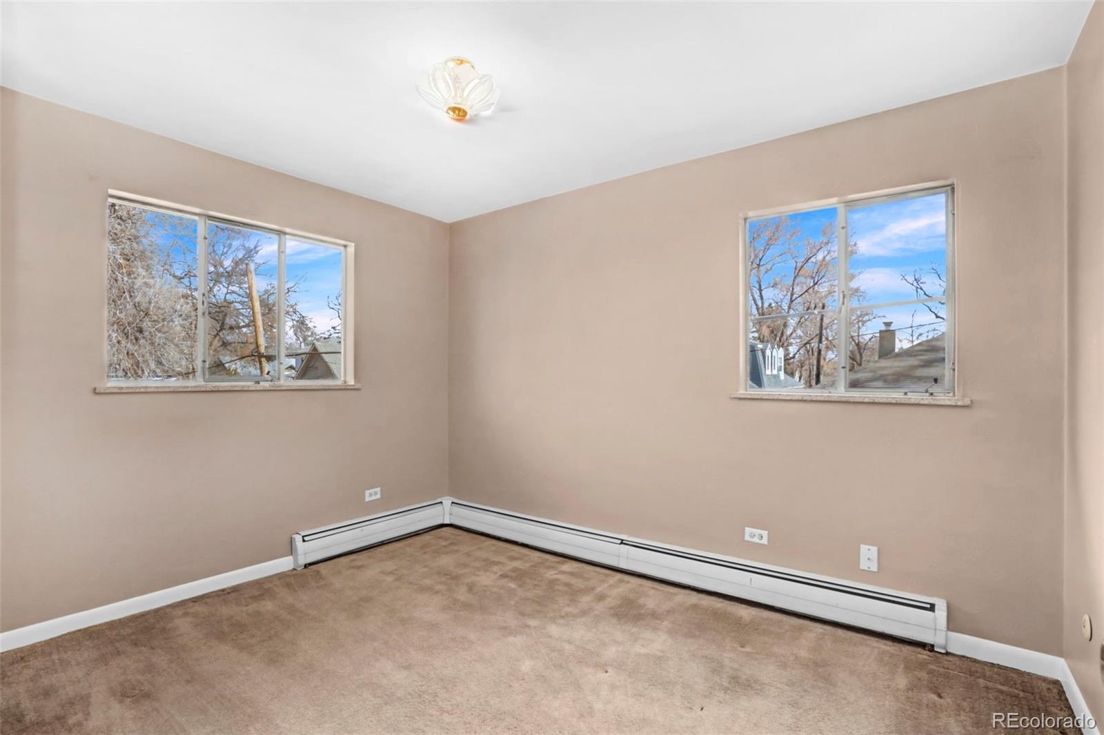 200 East Myrtle Street, Unit 8 Fort Collins, CO 80524 - Photo 13 of 21 an empty room with a painting on the wall