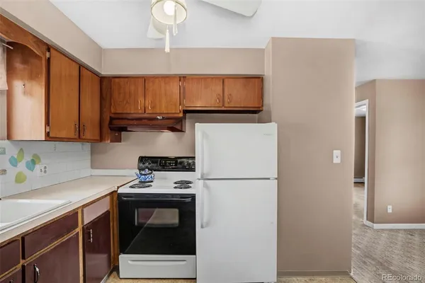 a kitchen with stainless steel appliances a refrigerator stove and sink