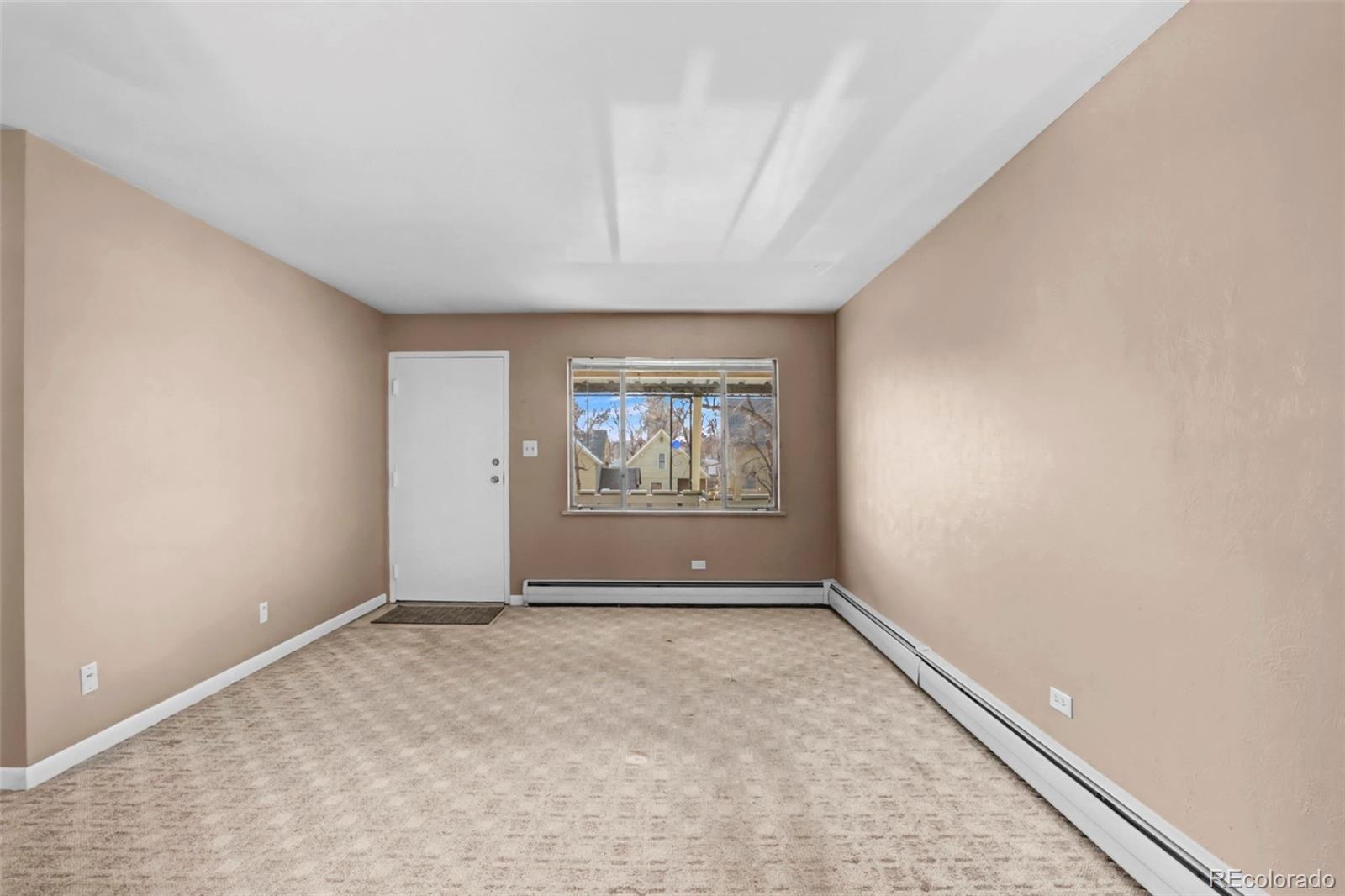 200 East Myrtle Street, Unit 8 Fort Collins, CO 80524 - Photo 7 of 21 an empty room with windows