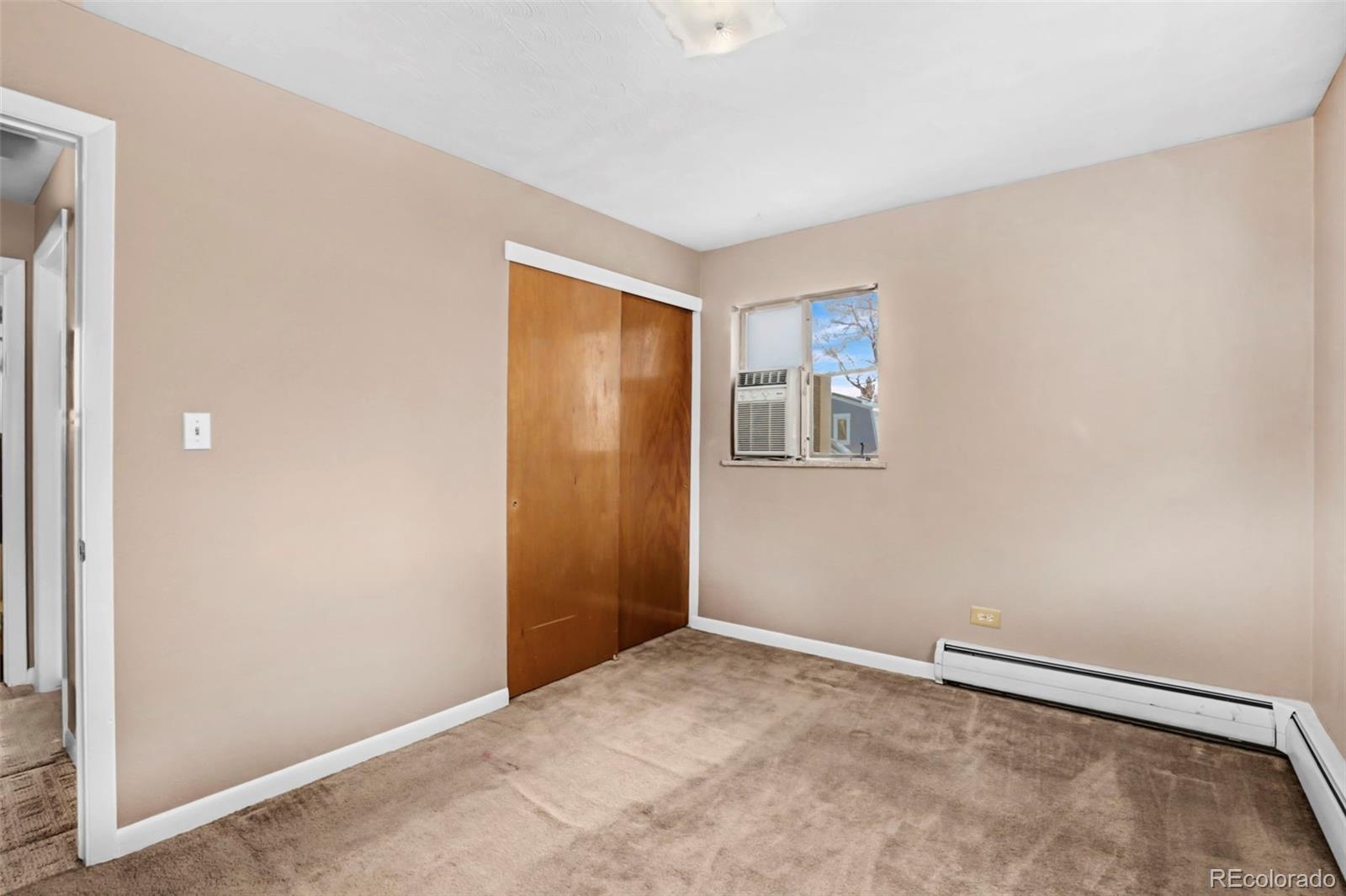 200 East Myrtle Street, Unit 8 Fort Collins, CO 80524 - Photo 10 of 21 a view of an empty room with a window