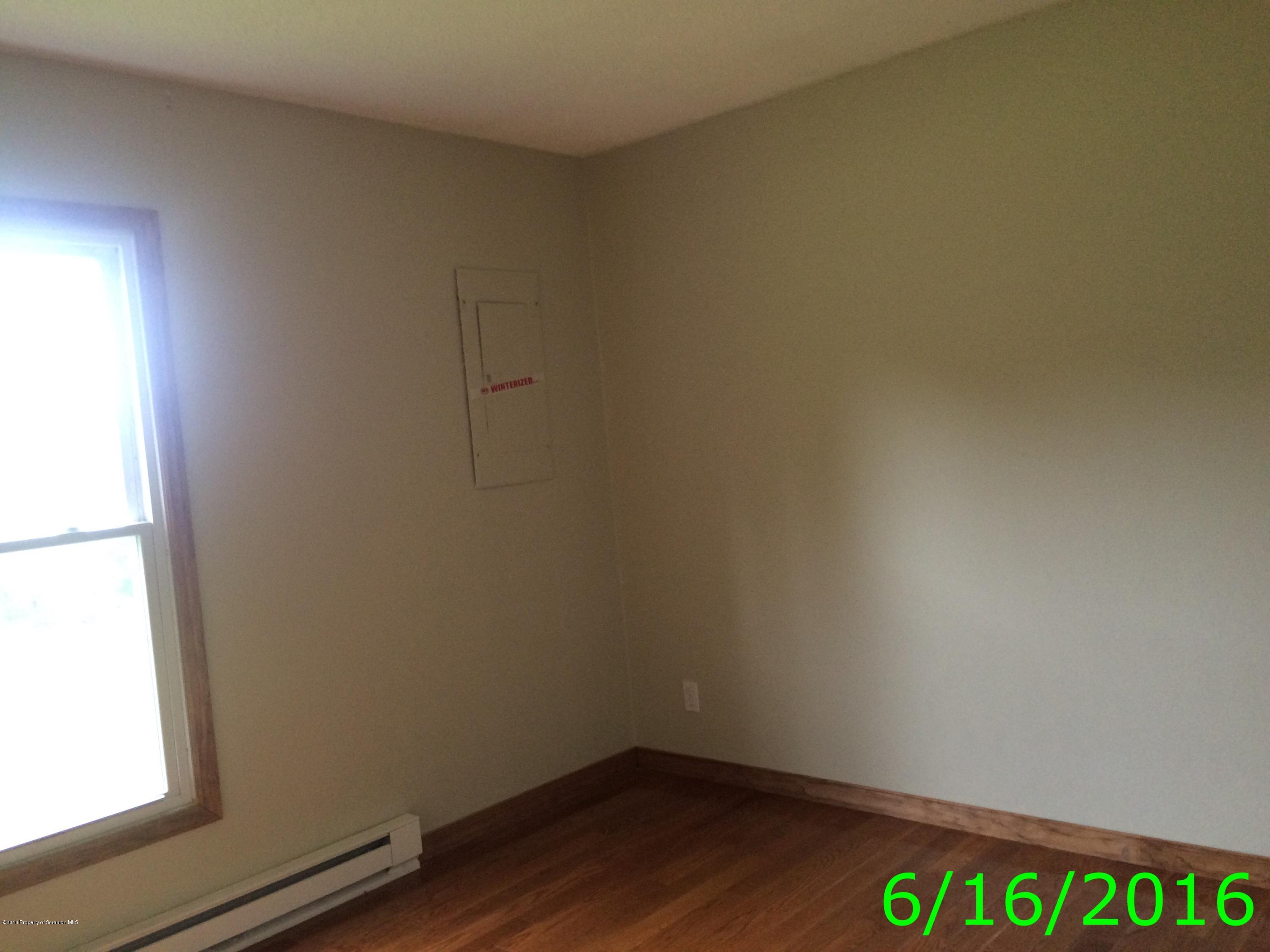 297 J&j Road Moscow, PA 18444 - Photo 11 of 25 an empty room with a window