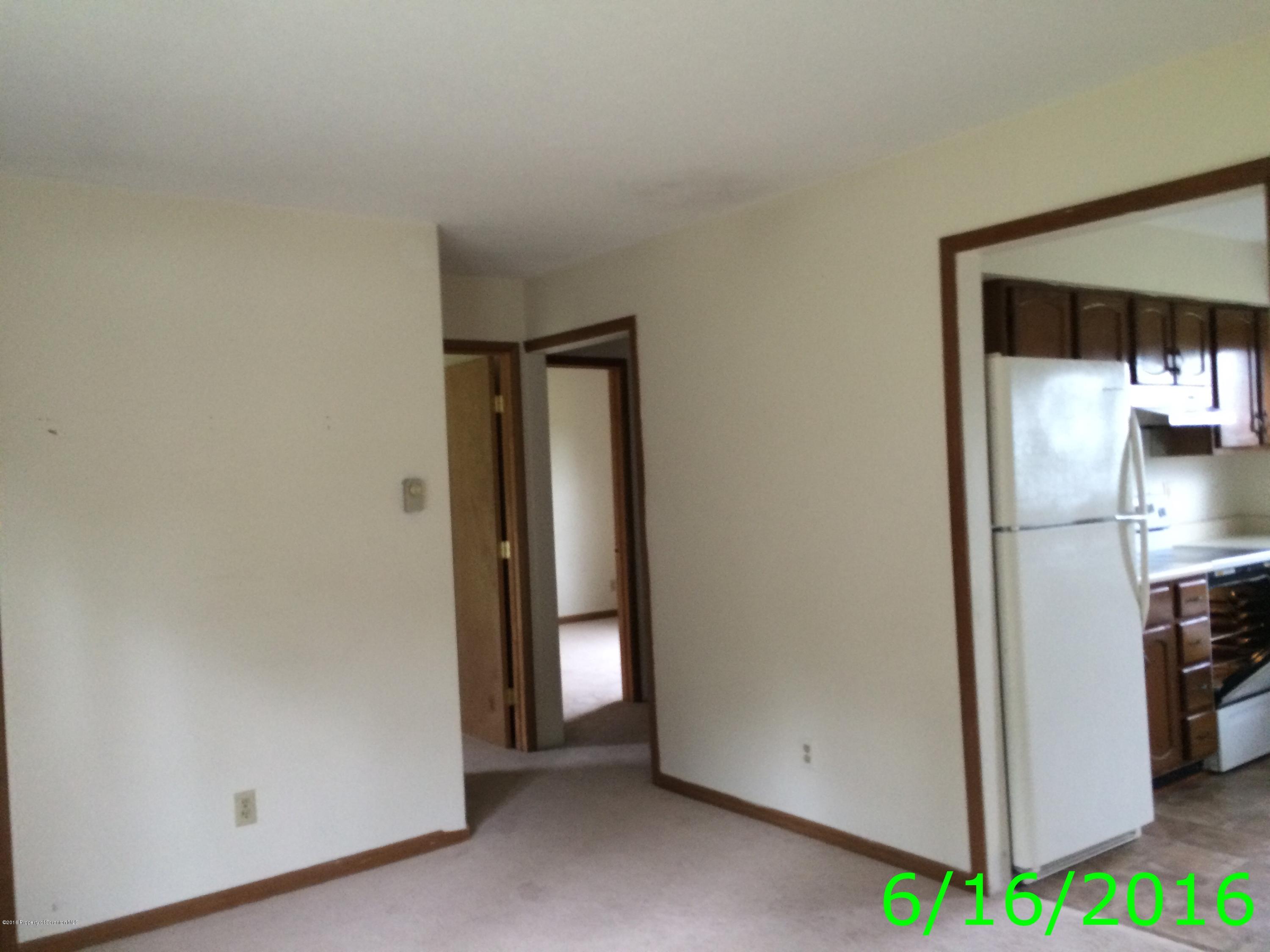 297 J&j Road Moscow, PA 18444 - Photo 17 of 25 a view of a kitchen from the hallway