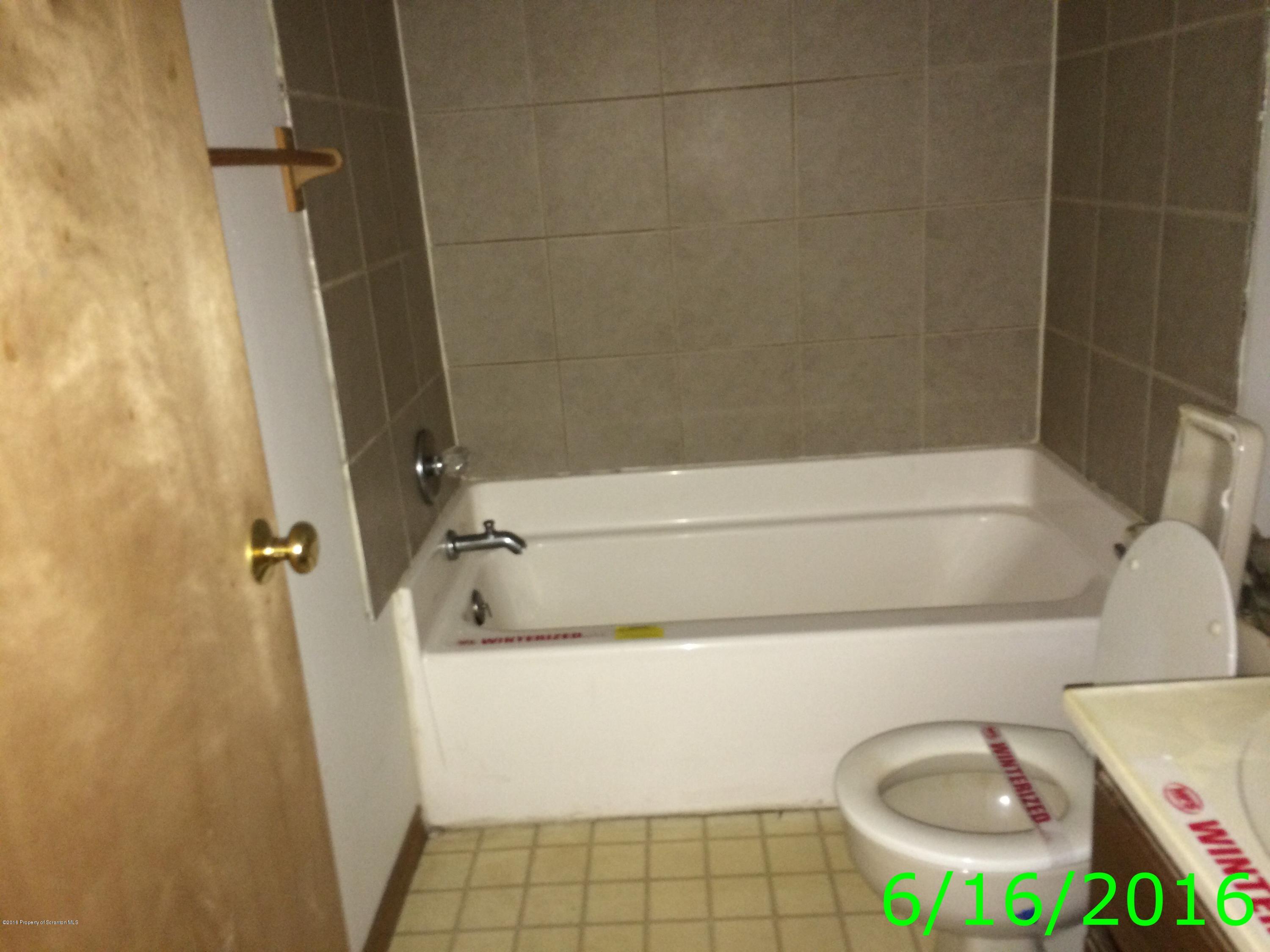 297 J&j Road Moscow, PA 18444 - Photo 21 of 25 a bathroom with a sink and a tub