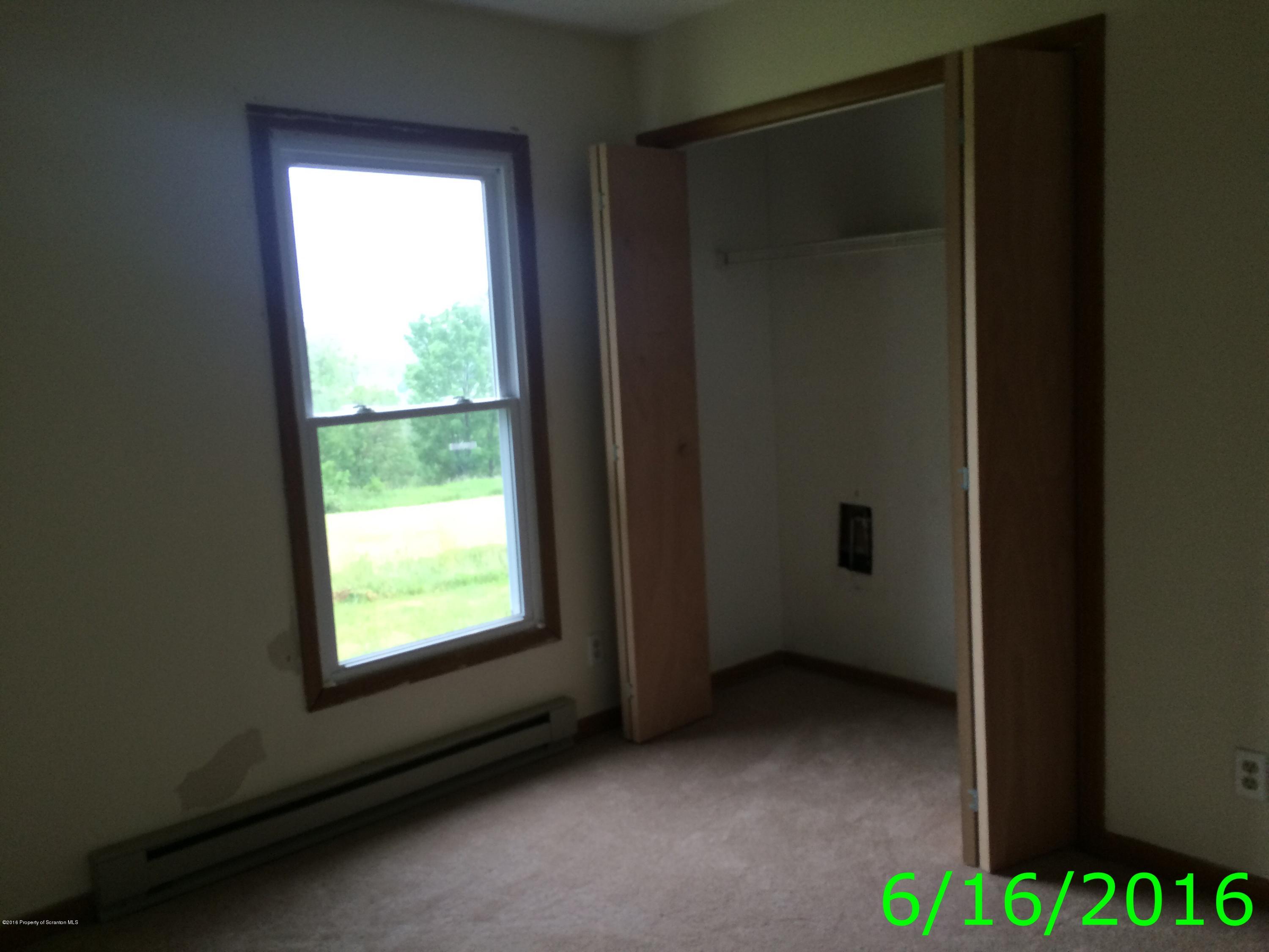 297 J&j Road Moscow, PA 18444 - Photo 23 of 25 a view of an empty room with a window