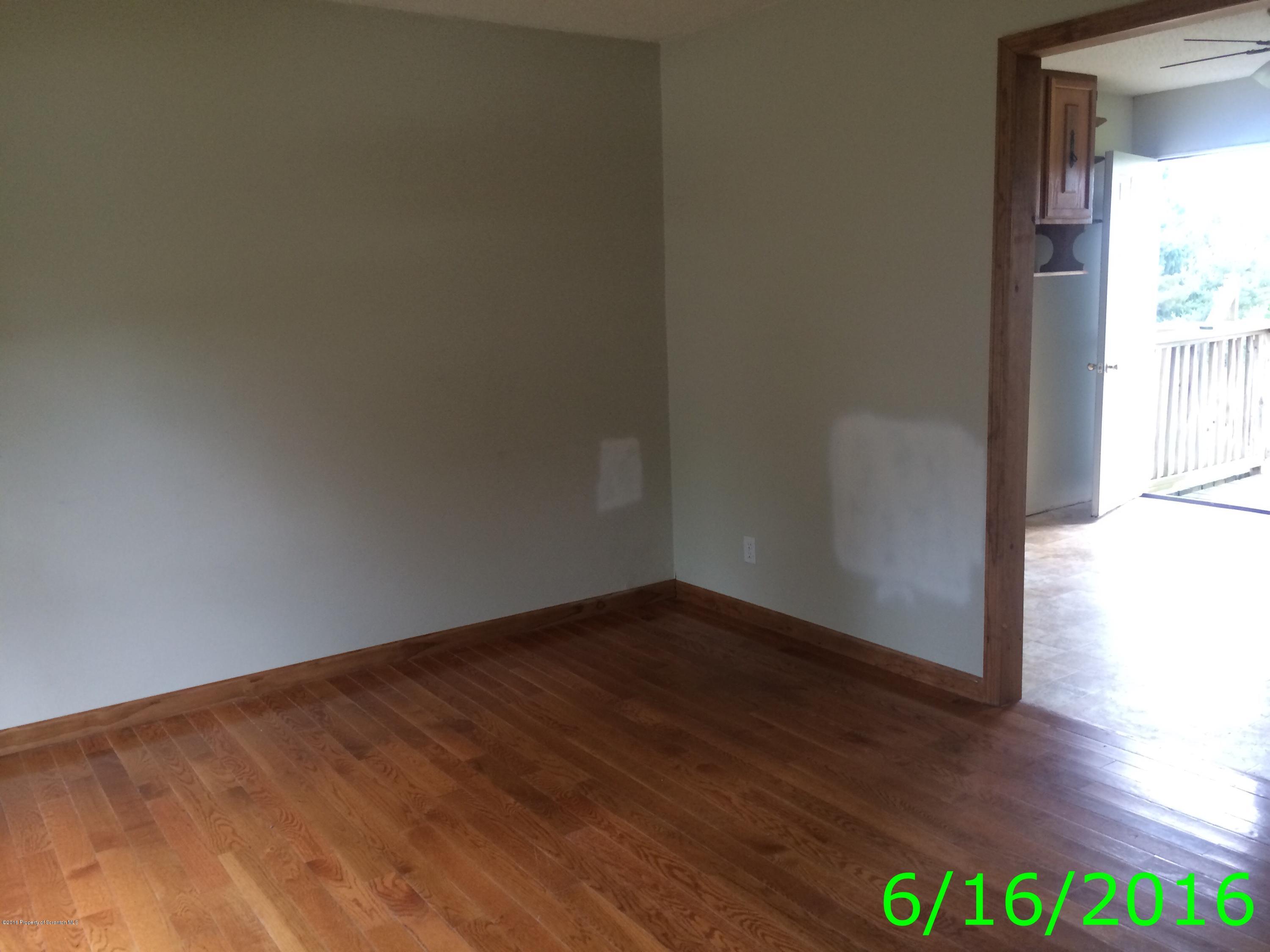 297 J&j Road Moscow, PA 18444 - Photo 5 of 25 a view of an empty room and wooden floor