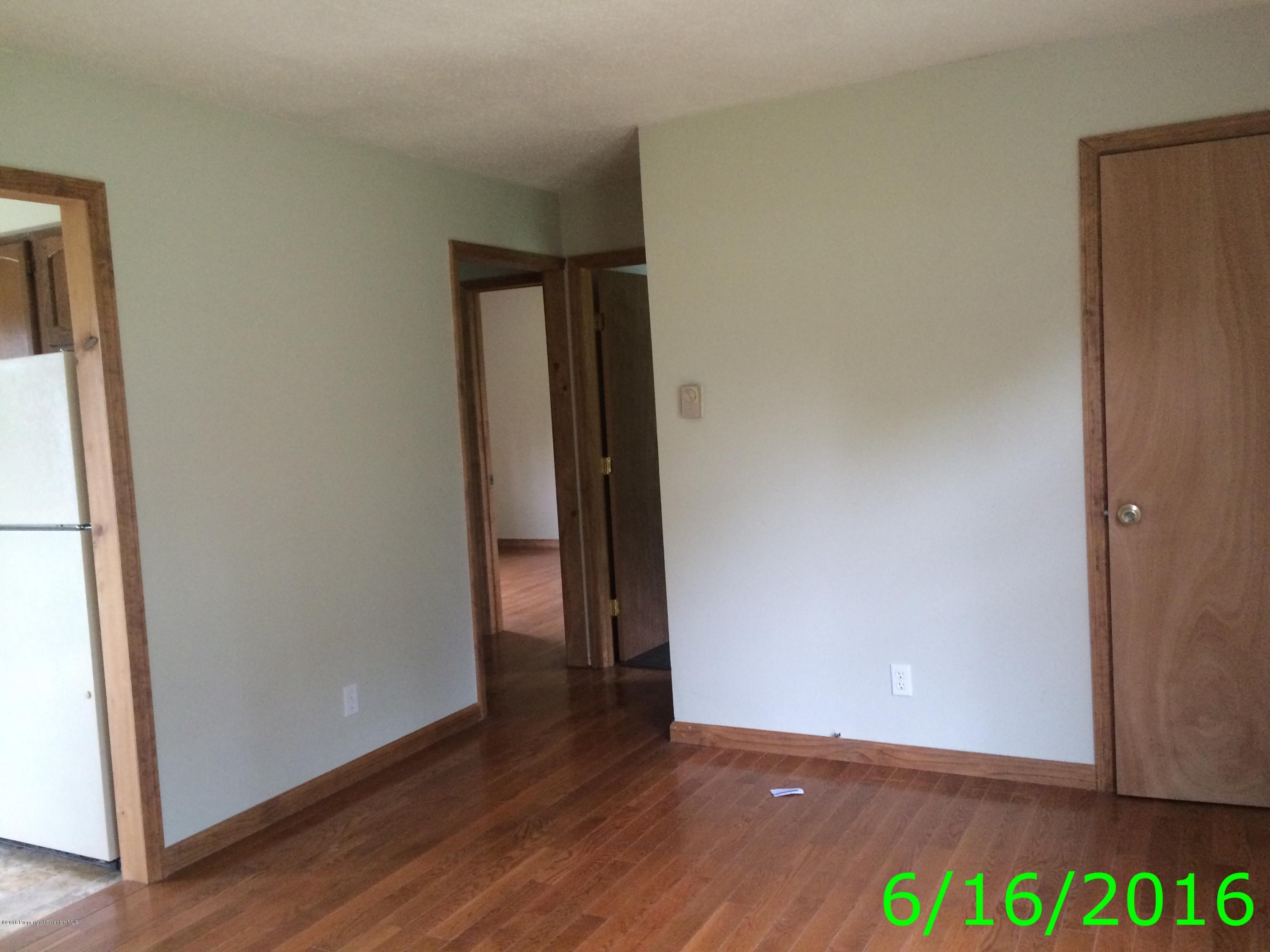 297 J&j Road Moscow, PA 18444 - Photo 6 of 25 a view of an empty room with wooden floor and closet