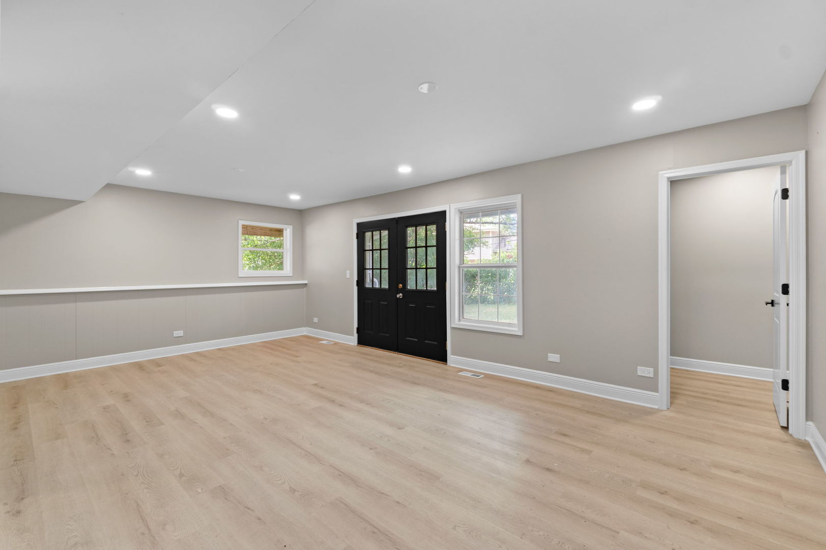 1180 Cobble Hill Court Hoffman Estates, IL 60169 - Photo 22 of 34 a view of an empty room with window and wooden floor