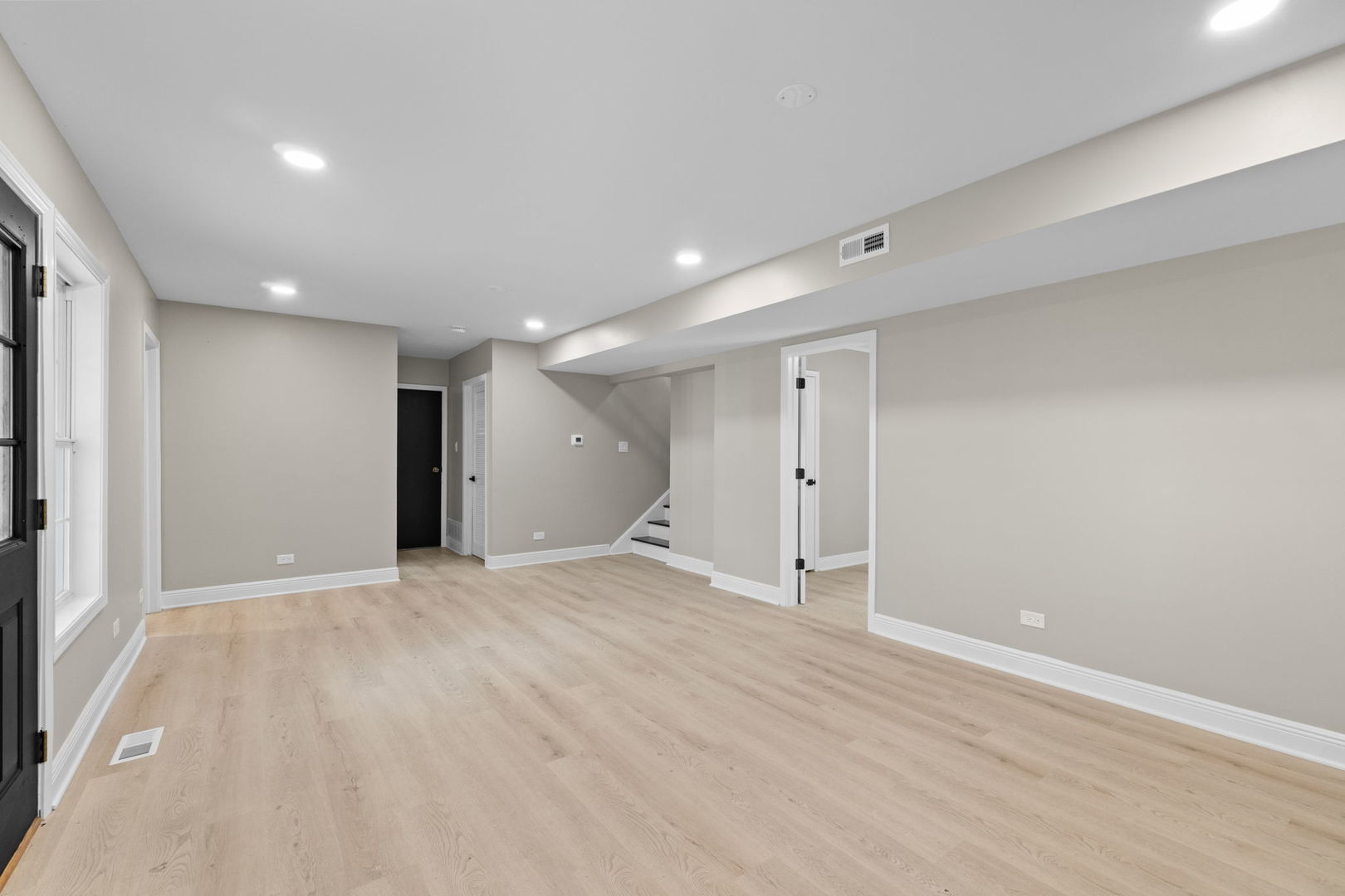 1180 Cobble Hill Court Hoffman Estates, IL 60169 - Photo 23 of 34 a view of an empty room with wooden floor