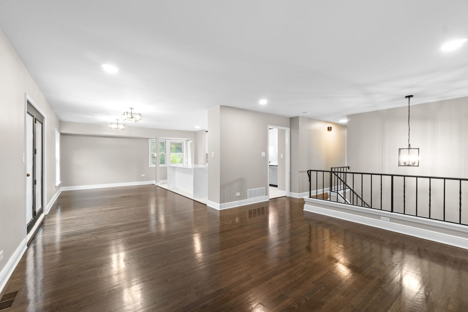 1180 Cobble Hill Court Hoffman Estates, IL 60169 - Photo 6 of 34 an empty room with wooden floor and windows