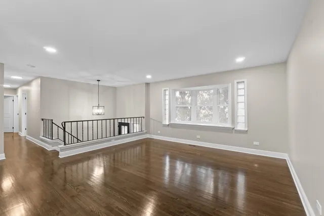 a view of an entryway with wooden floor