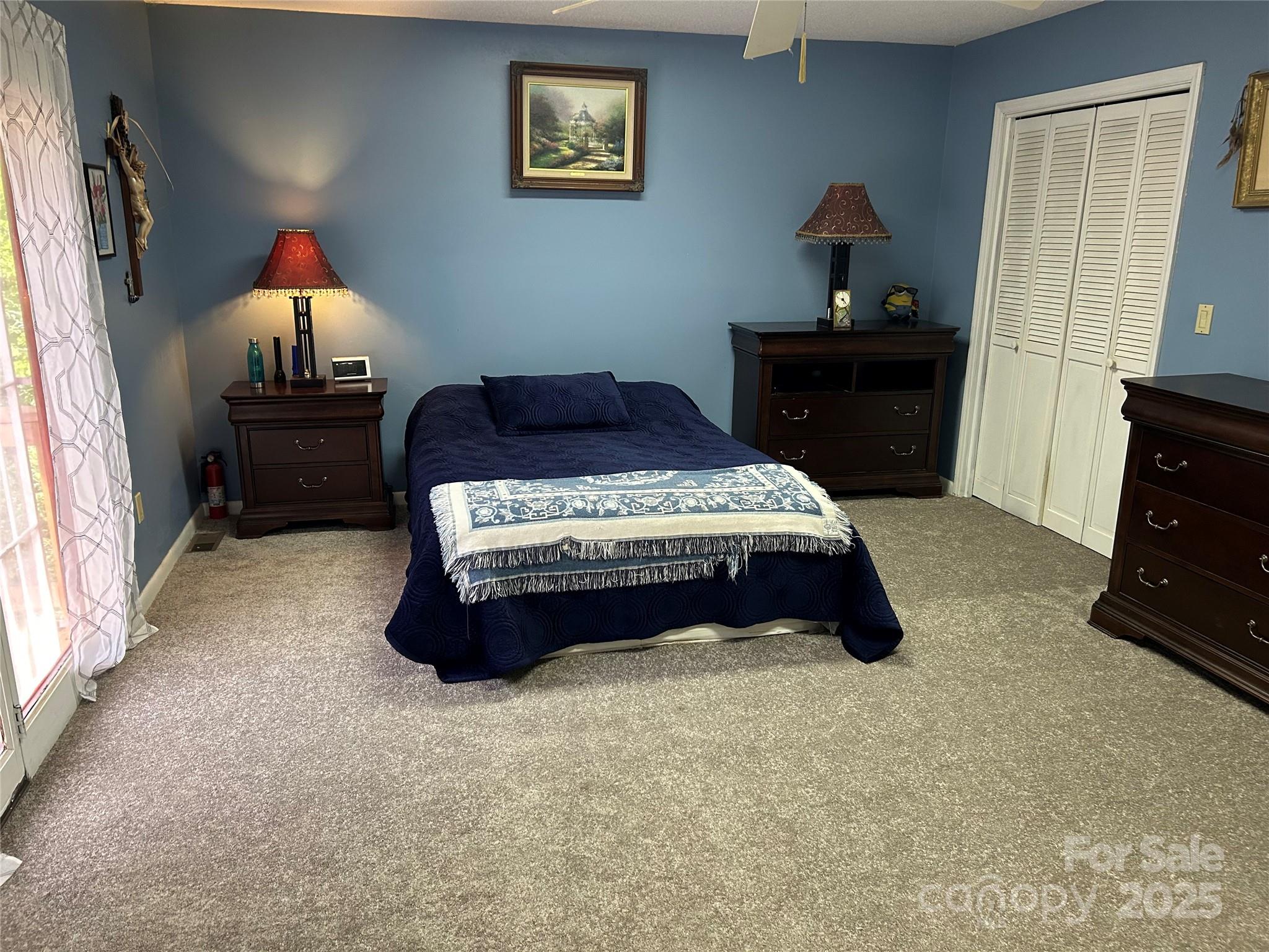 124 Blue Ridge Drive Rutherfordton, NC 28139 - Photo 25 of 48 a bedroom with a bed and a dresser in it