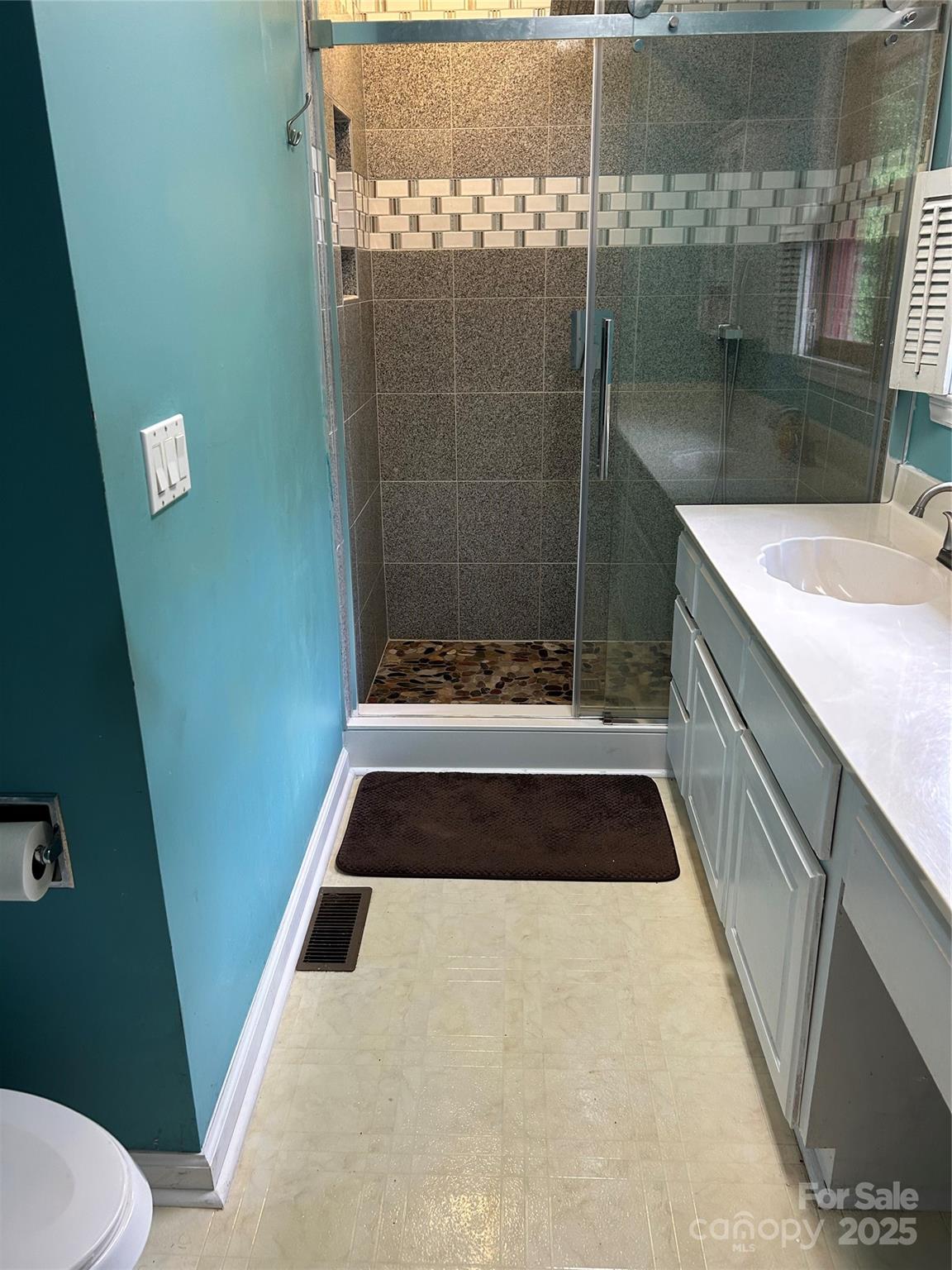 124 Blue Ridge Drive Rutherfordton, NC 28139 - Photo 27 of 48 a bathroom with a sink and a shower