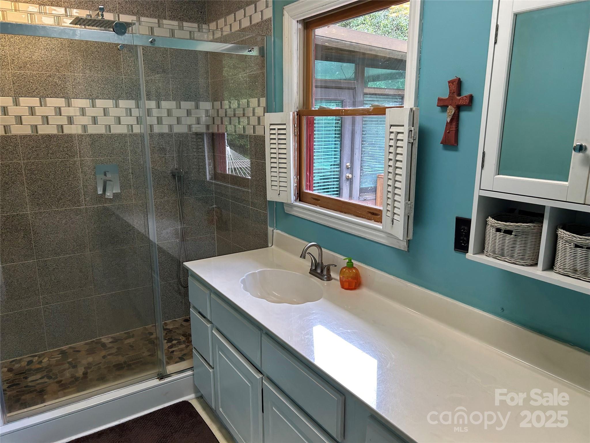 124 Blue Ridge Drive Rutherfordton, NC 28139 - Photo 28 of 48 a bathroom with a sink and a mirror