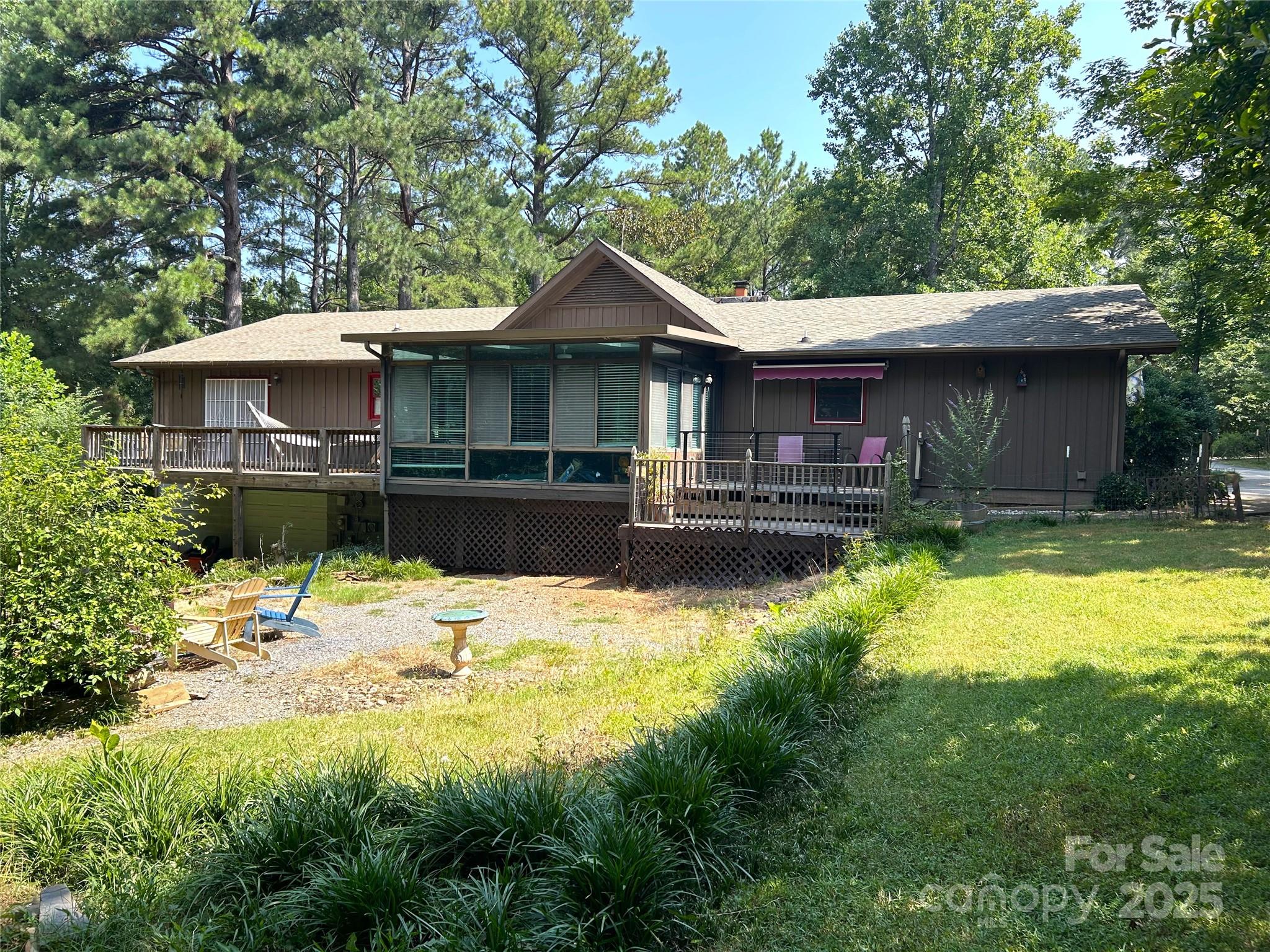 124 Blue Ridge Drive Rutherfordton, NC 28139 - Photo 3 of 48 a house with a swimming pool