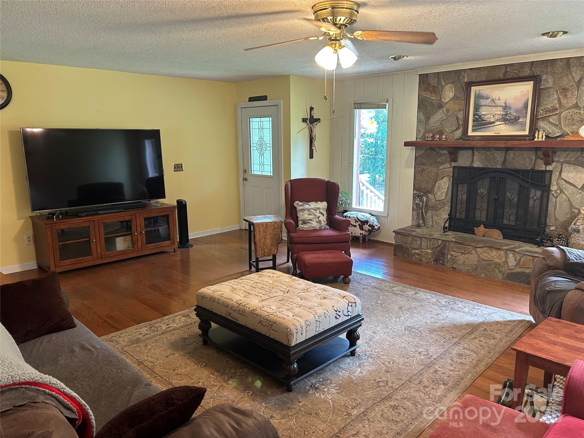 124 Blue Ridge Drive Rutherfordton, NC 28139 - Photo 10 of 48 a living room with furniture and a flat screen tv