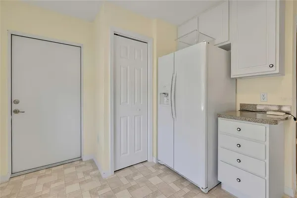 a bathroom with a granite countertop sink toilet and a mirror