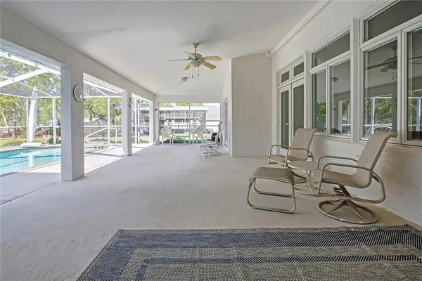 a view of a livingroom with furniture and white walls