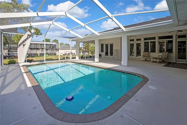 a view of a house with backyard patio and deck