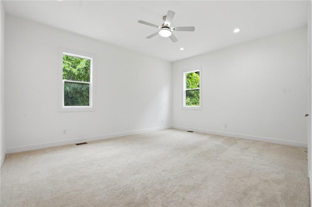 2415 West Rugby Avenue Atlanta, GA 30337 - Photo 24 of 40 an empty room with windows and closet