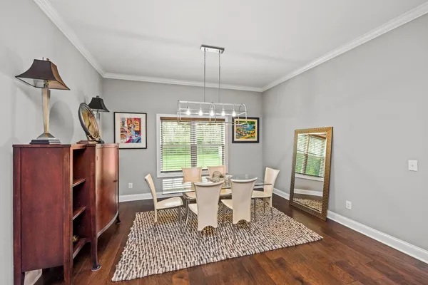 a living room with furniture rug and window