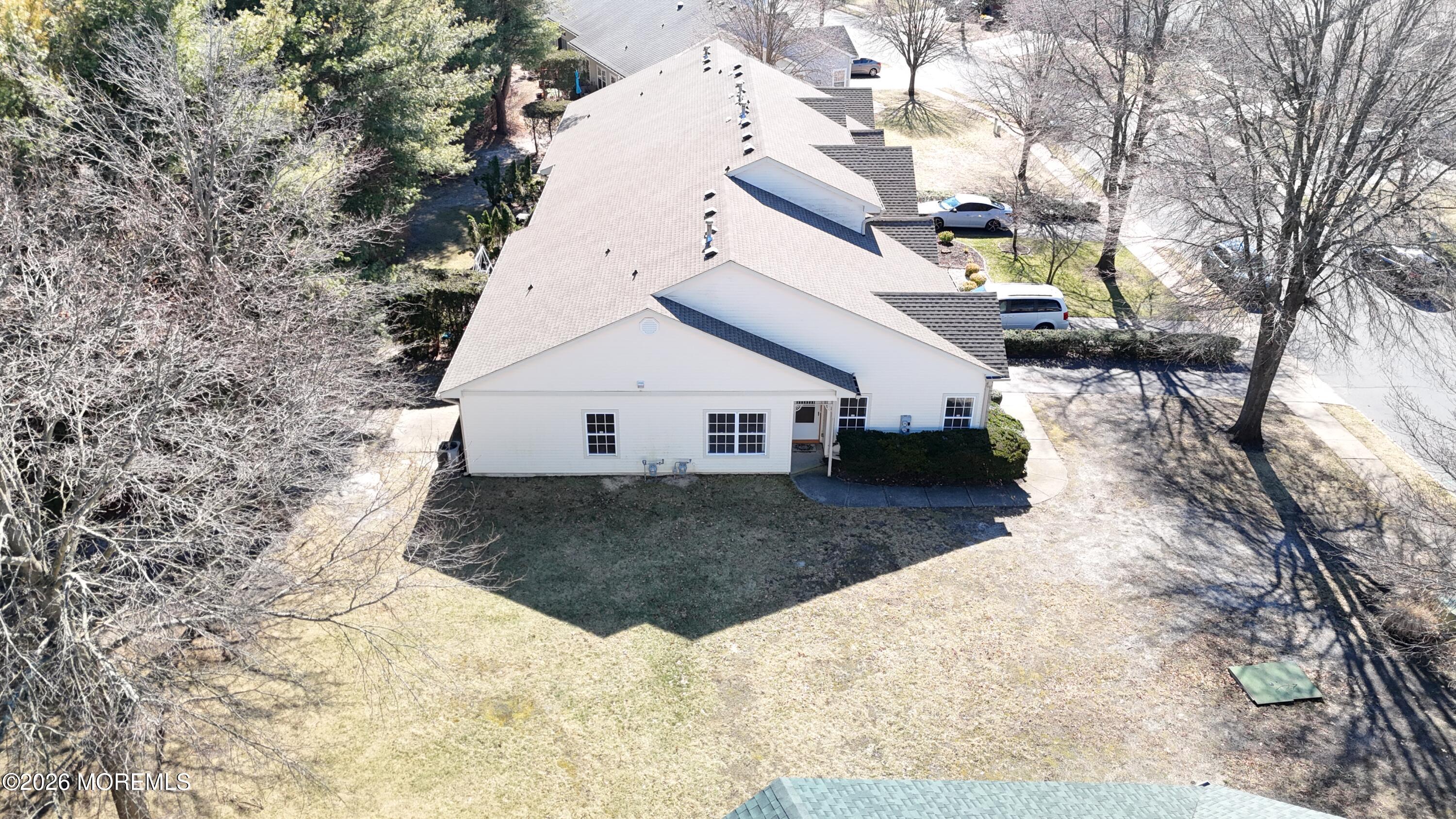 56 Riva Boulevard Brick, NJ 08723 - Photo 13 of 29 a view of a house with a yard covered in snow