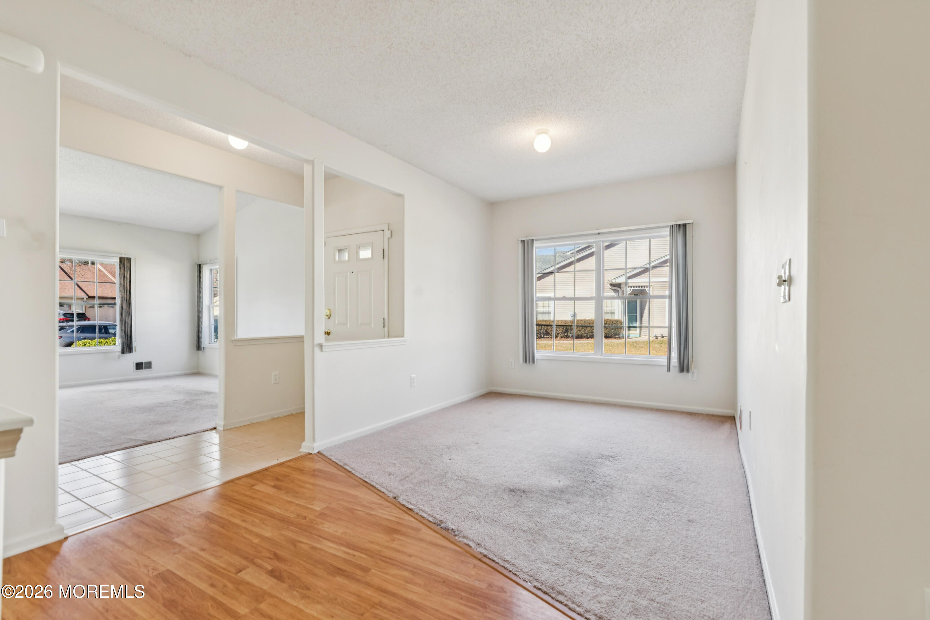 56 Riva Boulevard Brick, NJ 08723 - Photo 15 of 29 an empty room with windows and entrance