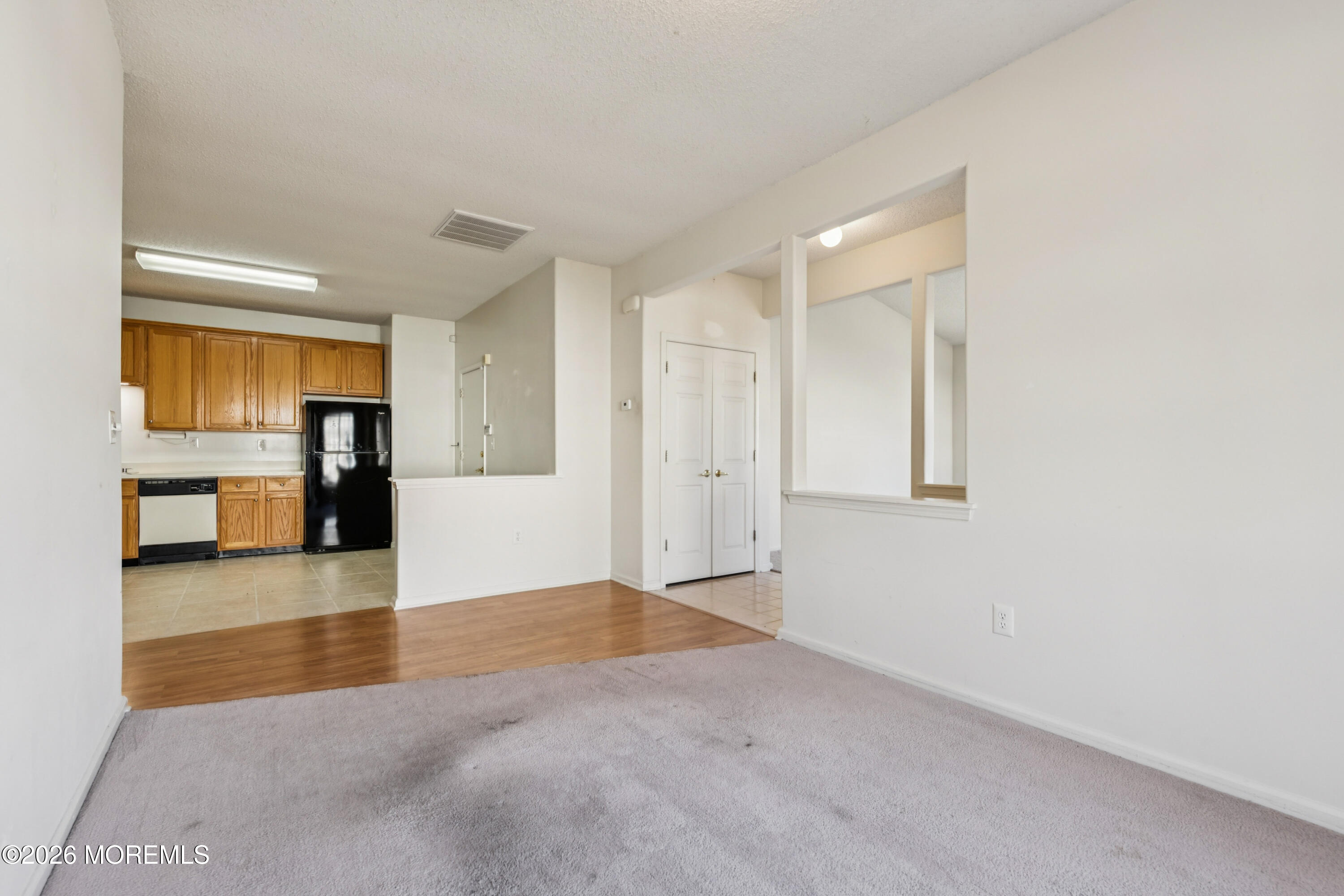 56 Riva Boulevard Brick, NJ 08723 - Photo 16 of 29 a view of an empty room with a kitchen