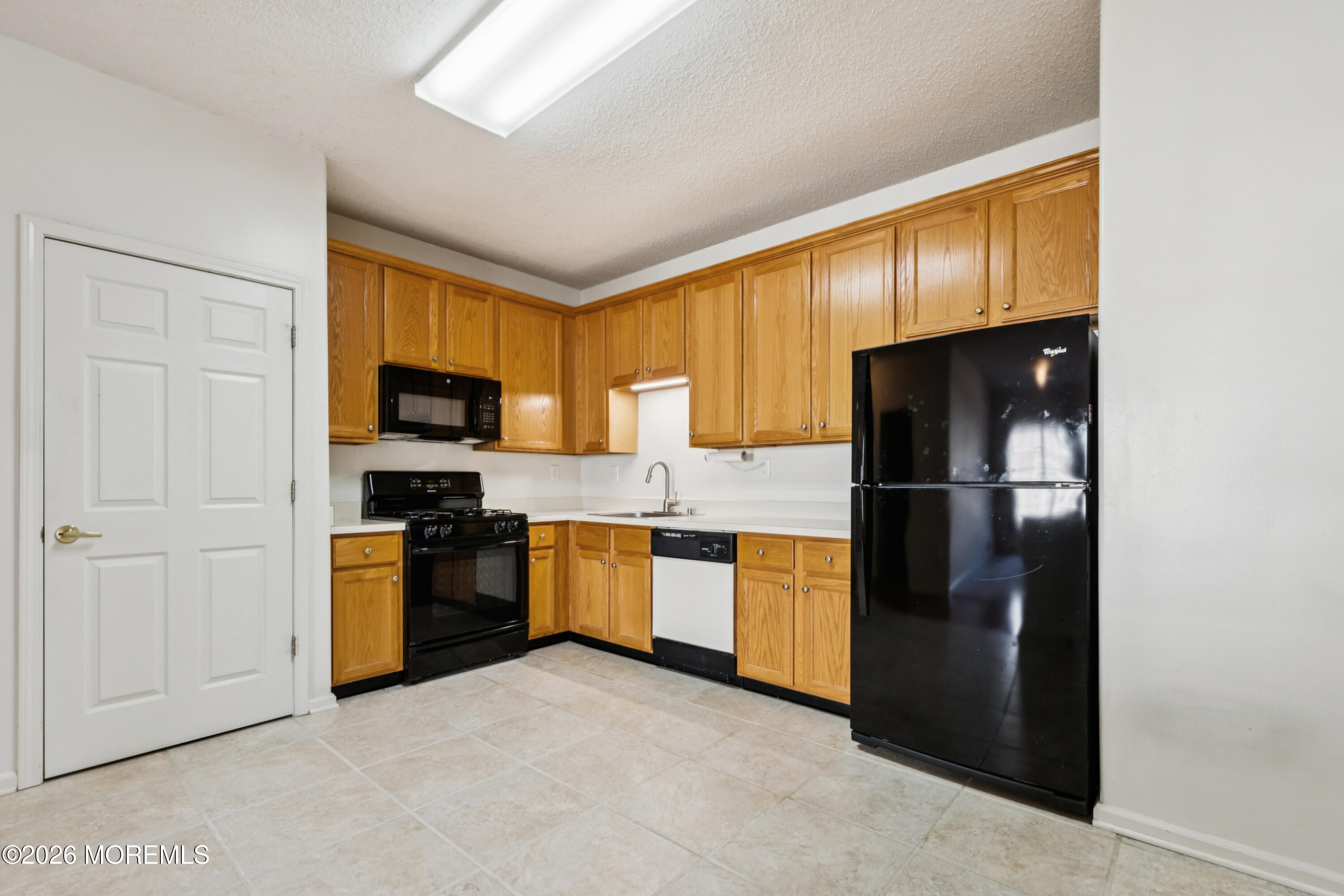 56 Riva Boulevard Brick, NJ 08723 - Photo 18 of 29 a kitchen with stainless steel appliances granite countertop a refrigerator stove and microwave