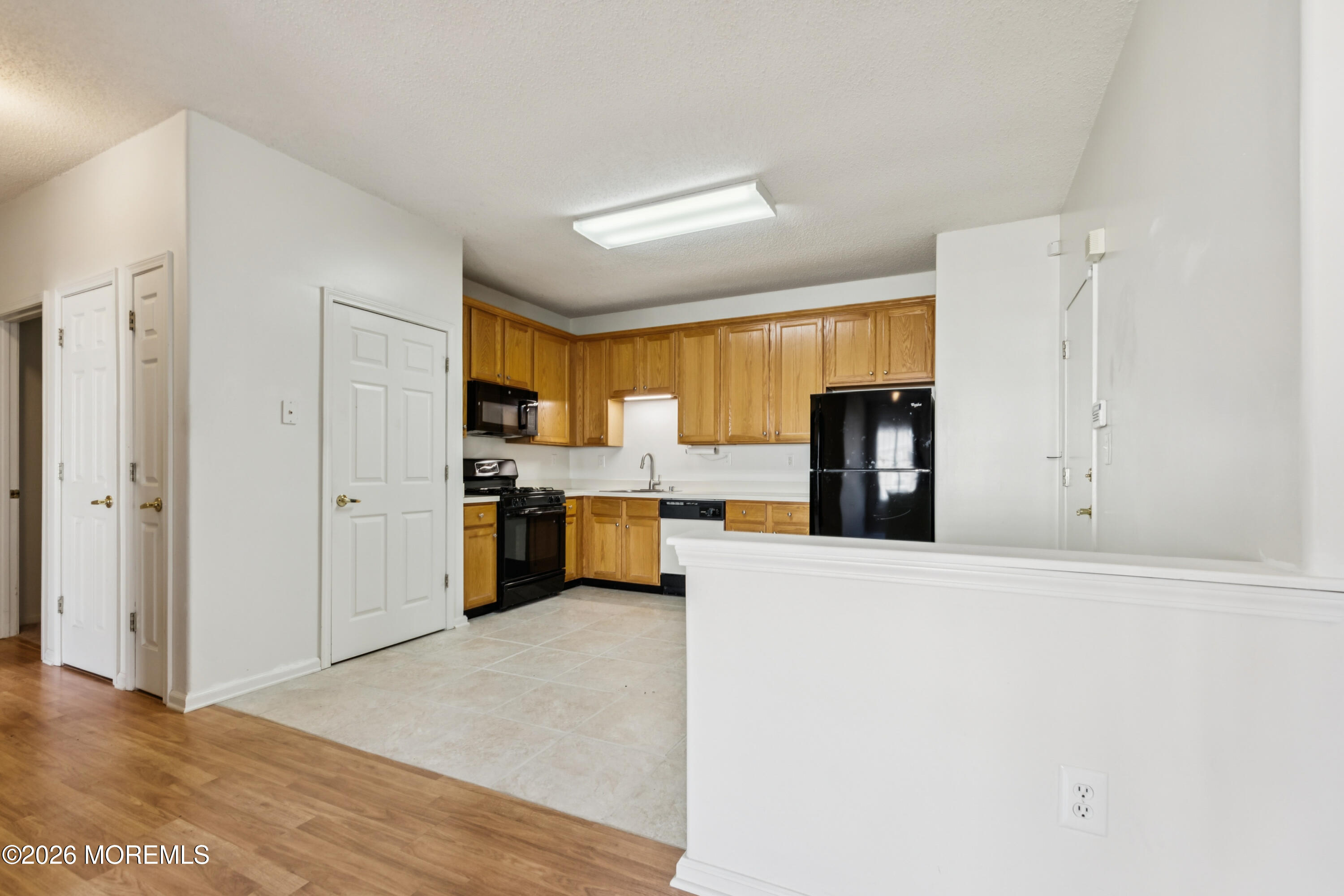 56 Riva Boulevard Brick, NJ 08723 - Photo 19 of 29 a view of a kitchen with refrigerator and windows