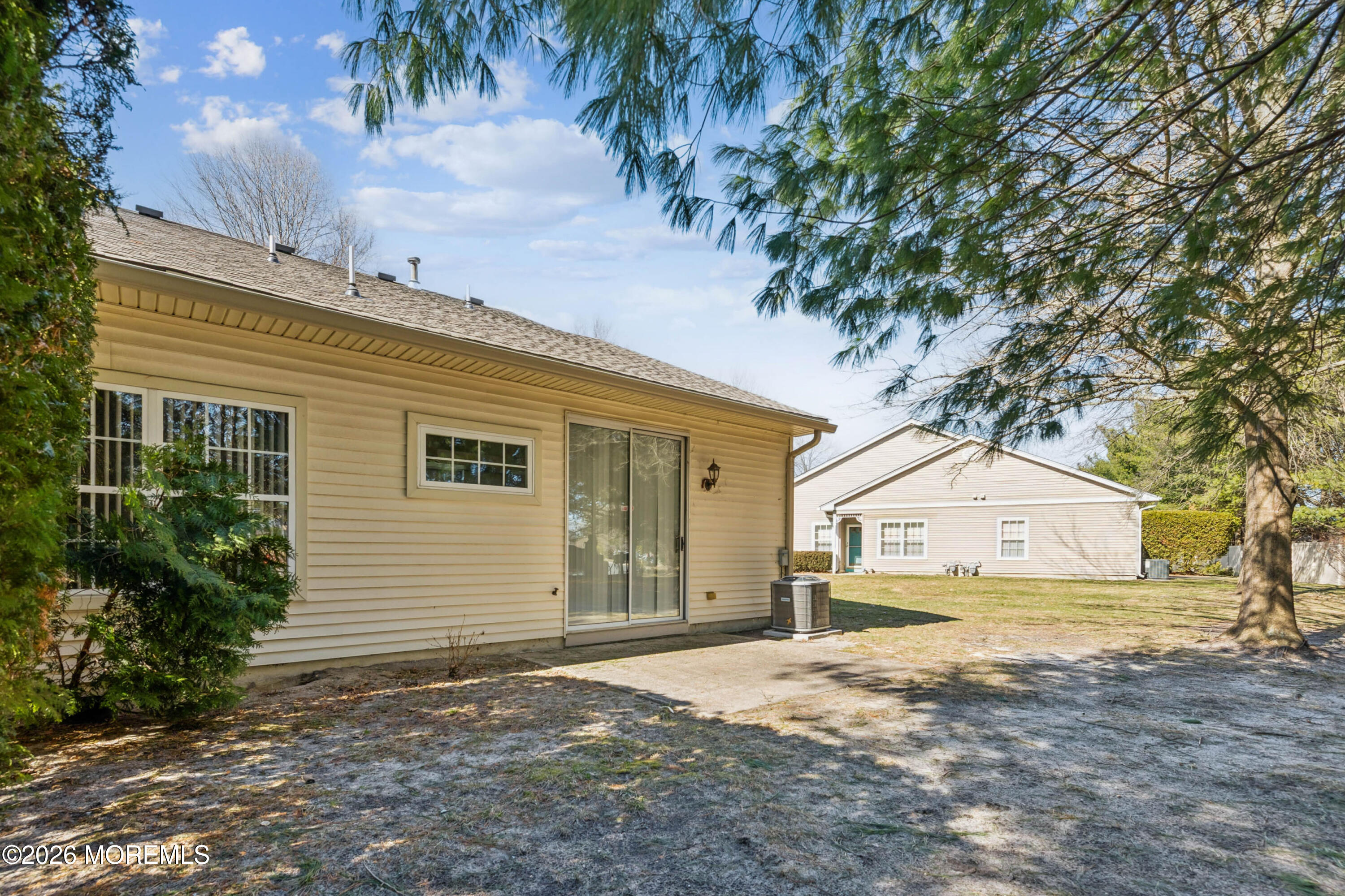 56 Riva Boulevard Brick, NJ 08723 - Photo 2 of 29 a front view of a house with a yard and garage