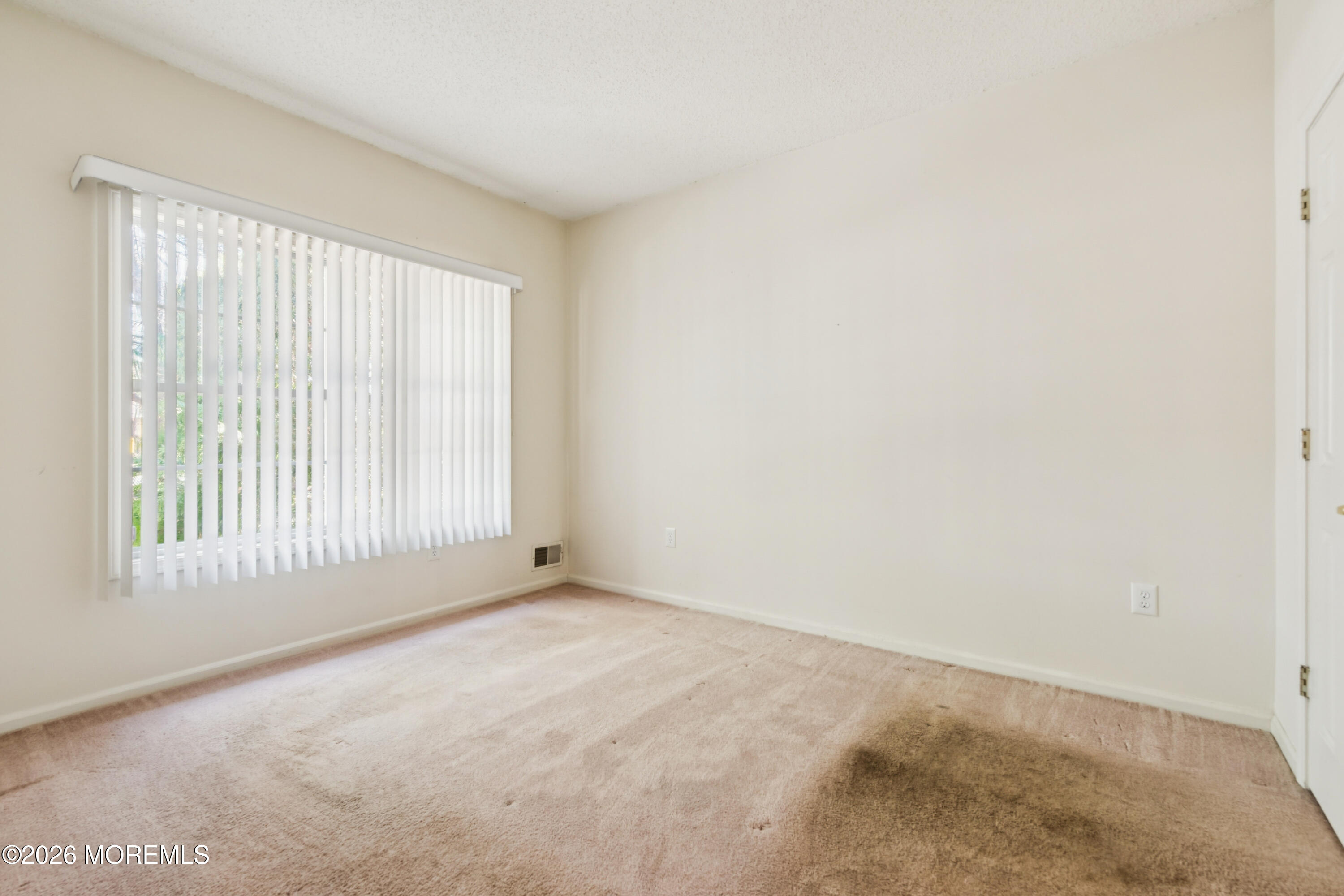 56 Riva Boulevard Brick, NJ 08723 - Photo 26 of 29 a view of an empty room with a window
