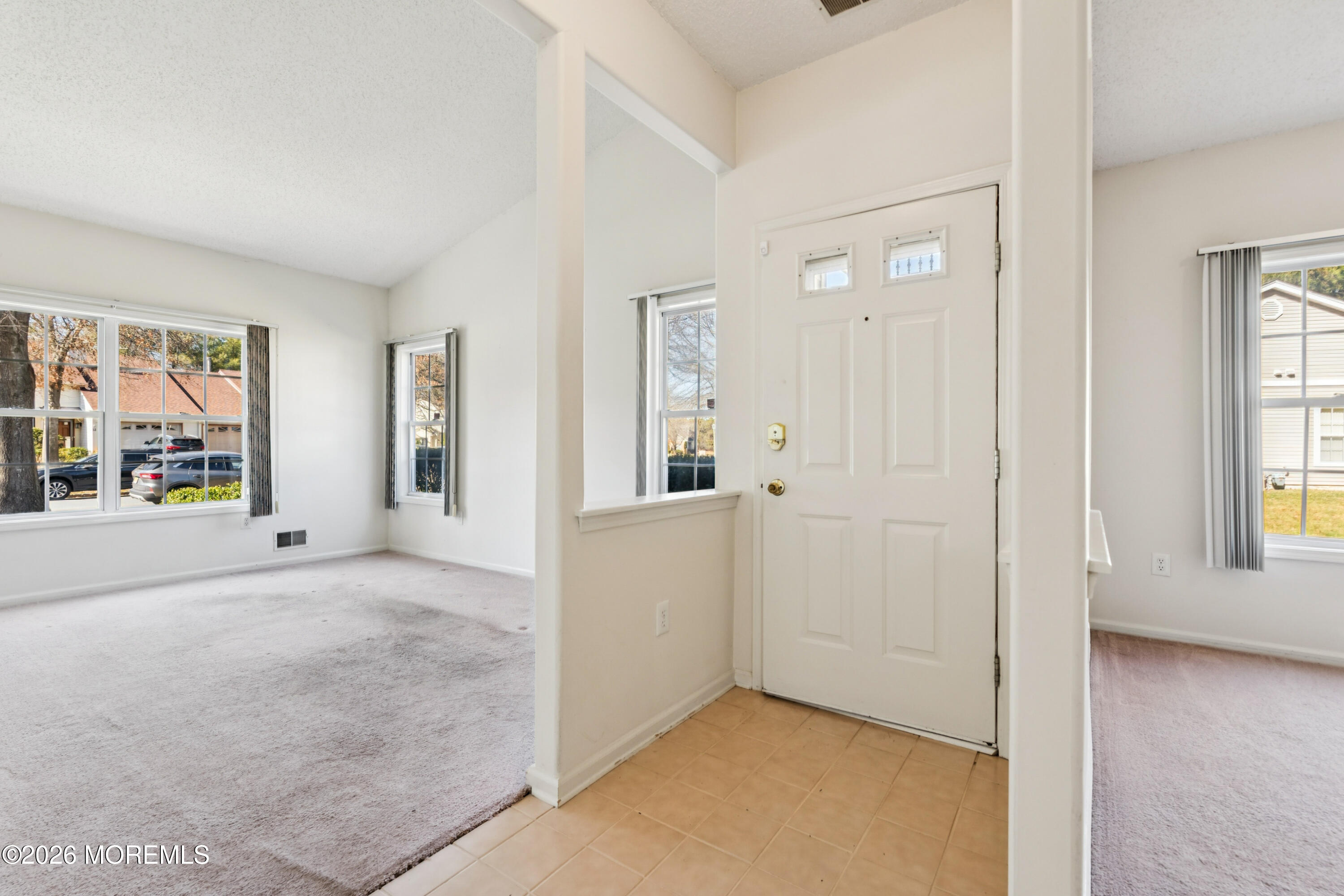 56 Riva Boulevard Brick, NJ 08723 - Photo 9 of 29 an empty room with windows and closet