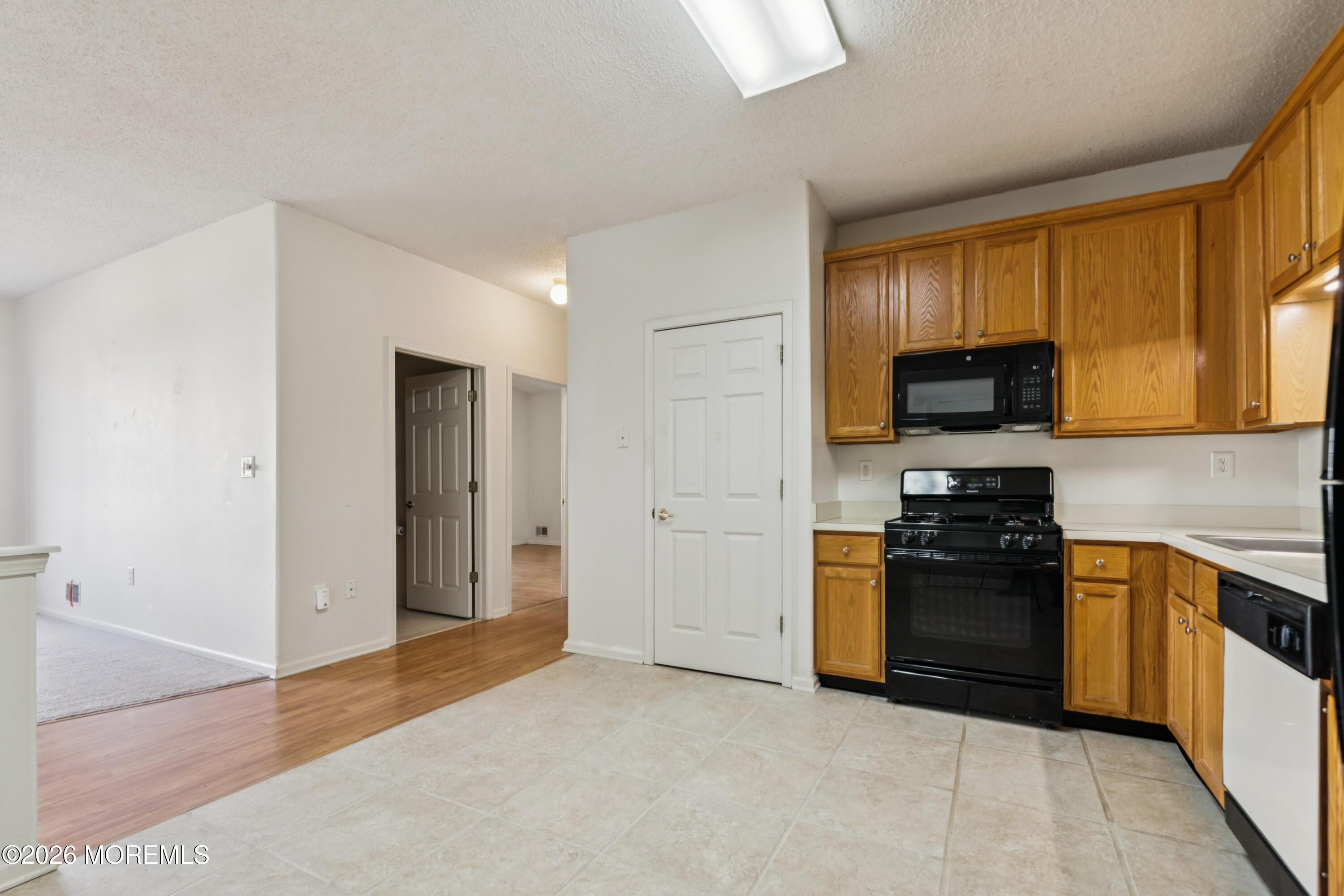 56 Riva Boulevard Brick, NJ 08723 - Photo 10 of 29 a kitchen with stainless steel appliances granite countertop a refrigerator stove top oven a sink and dishwasher