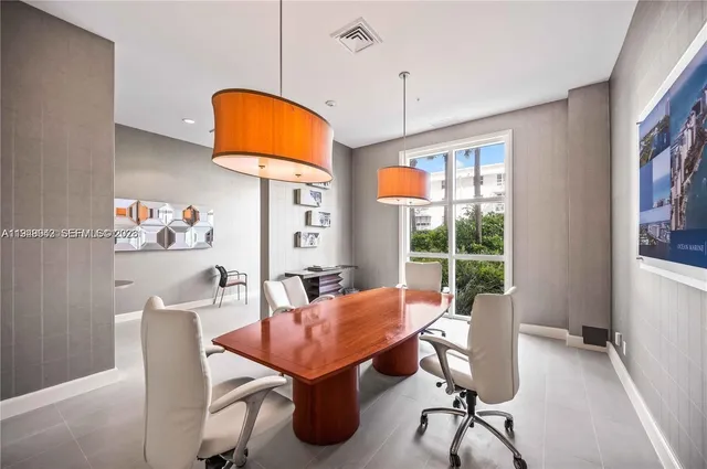 a view of a dining room with furniture water and chandelier