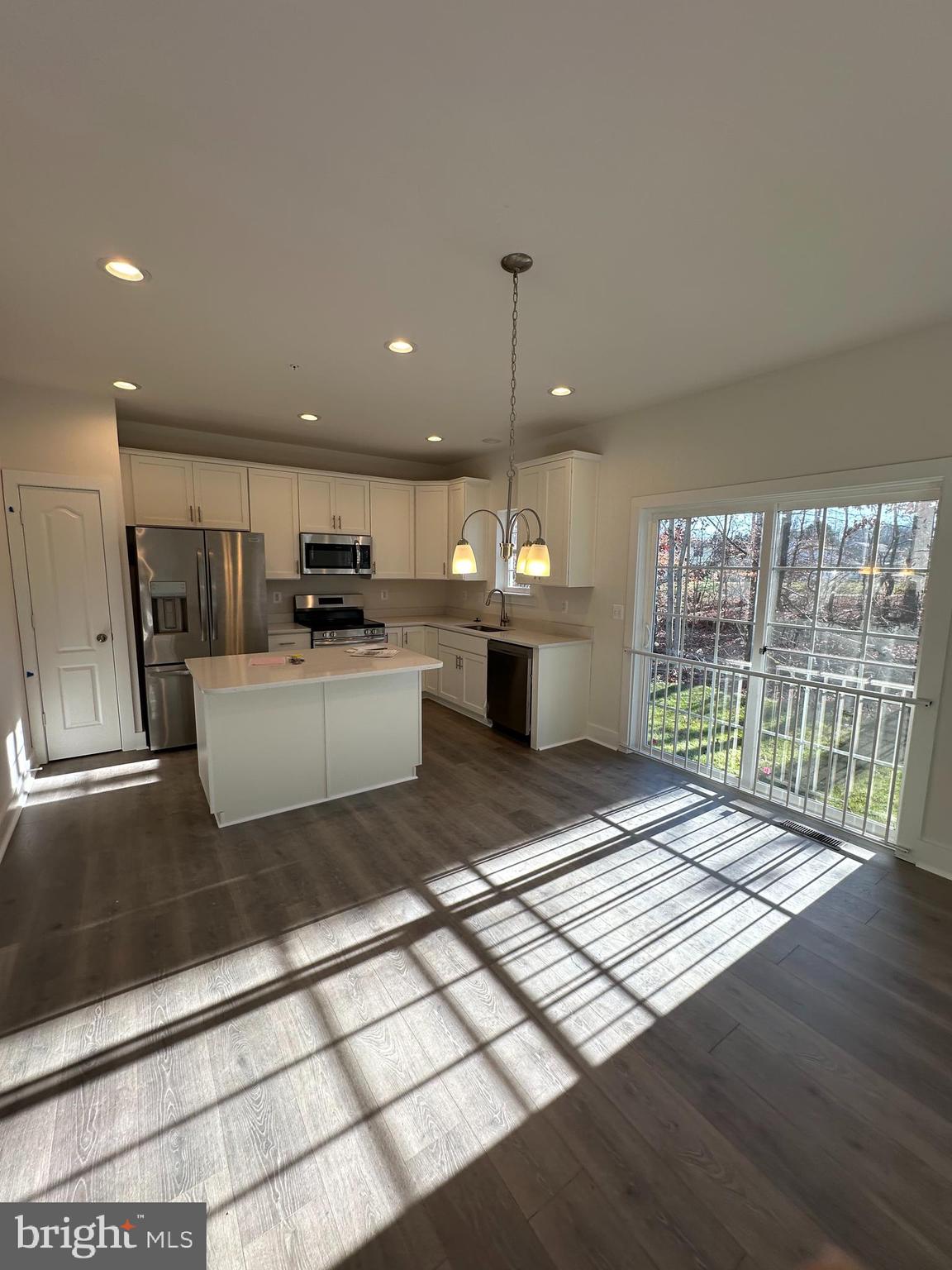 175 Chapel Road Gettysburg, PA 17325 - Photo 7 of 30 a open kitchen with stainless steel appliances granite countertop a refrigerator a sink dishwasher a stove and a microwave oven with wooden floor