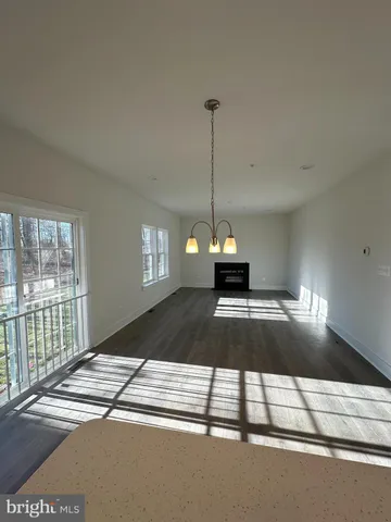a view of empty room with windows