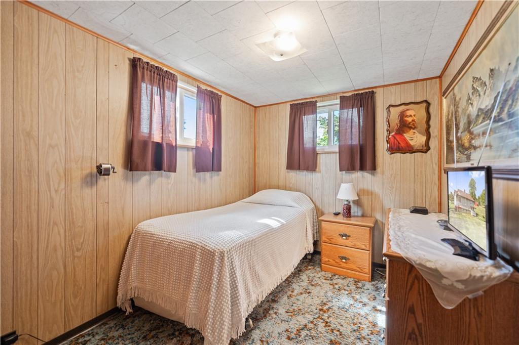 14 Pumpkin Center Road Finleyville, PA 15332 - Photo 18 of 34 a bedroom with a bed and a flat screen tv