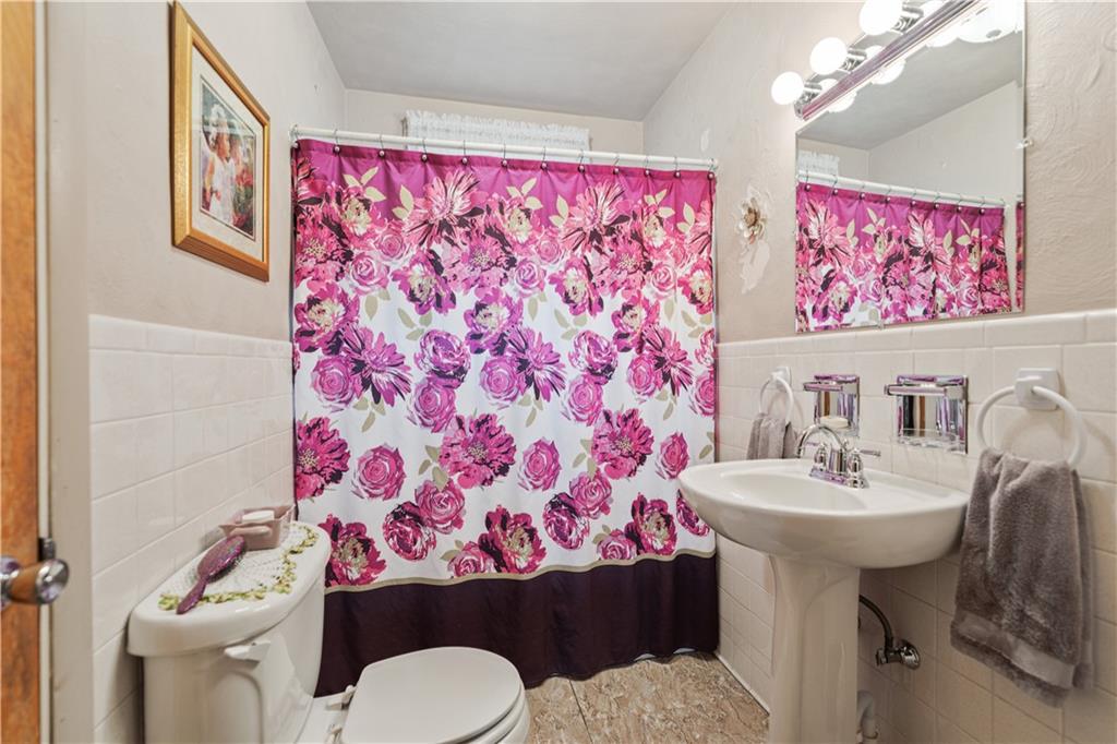 14 Pumpkin Center Road Finleyville, PA 15332 - Photo 20 of 34 a bathroom with a sink toilet and a mirror