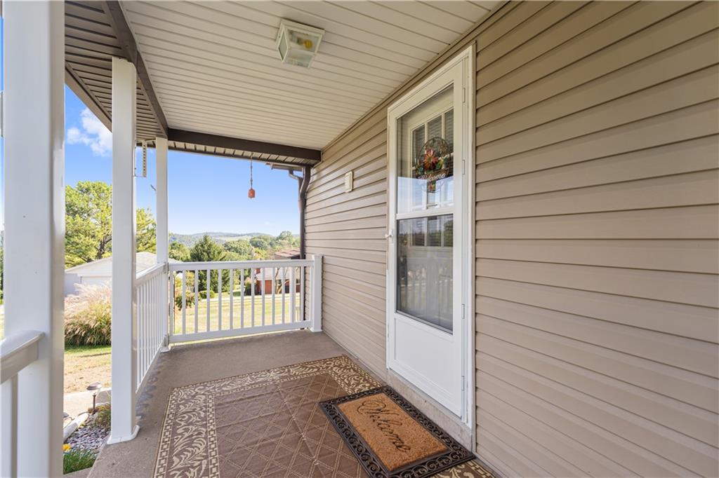 14 Pumpkin Center Road Finleyville, PA 15332 - Photo 23 of 34 a view of a porch with wooden floor