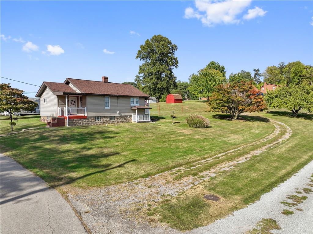 14 Pumpkin Center Road Finleyville, PA 15332 - Photo 3 of 34 a front view of a house with garden