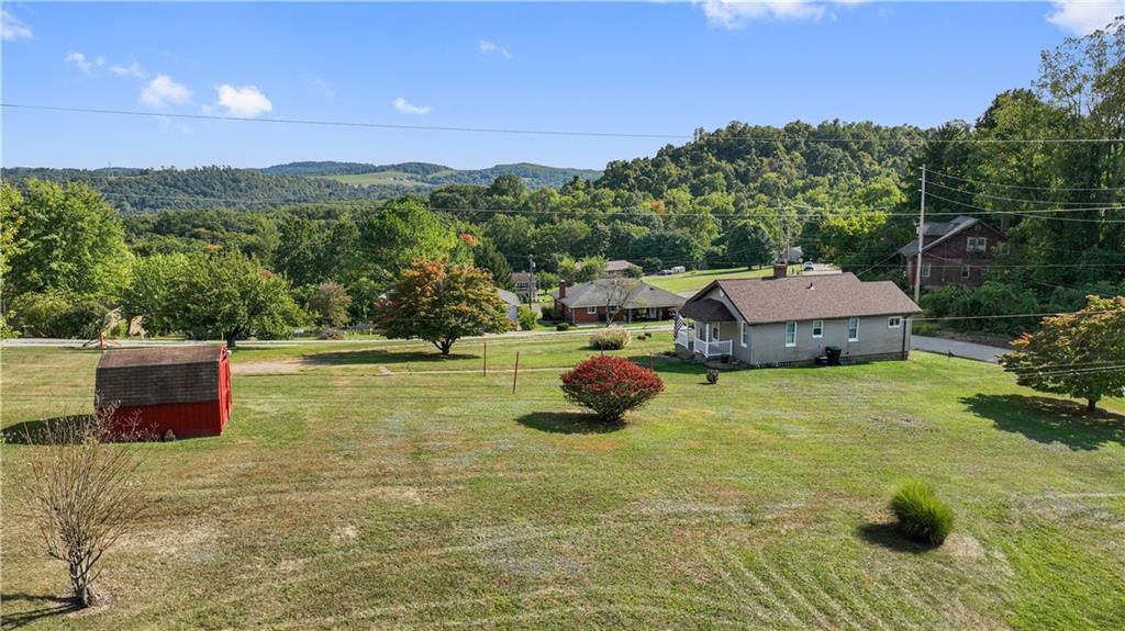 14 Pumpkin Center Road Finleyville, PA 15332 - Photo 34 of 34 a backyard of a house with yard and outdoor seating