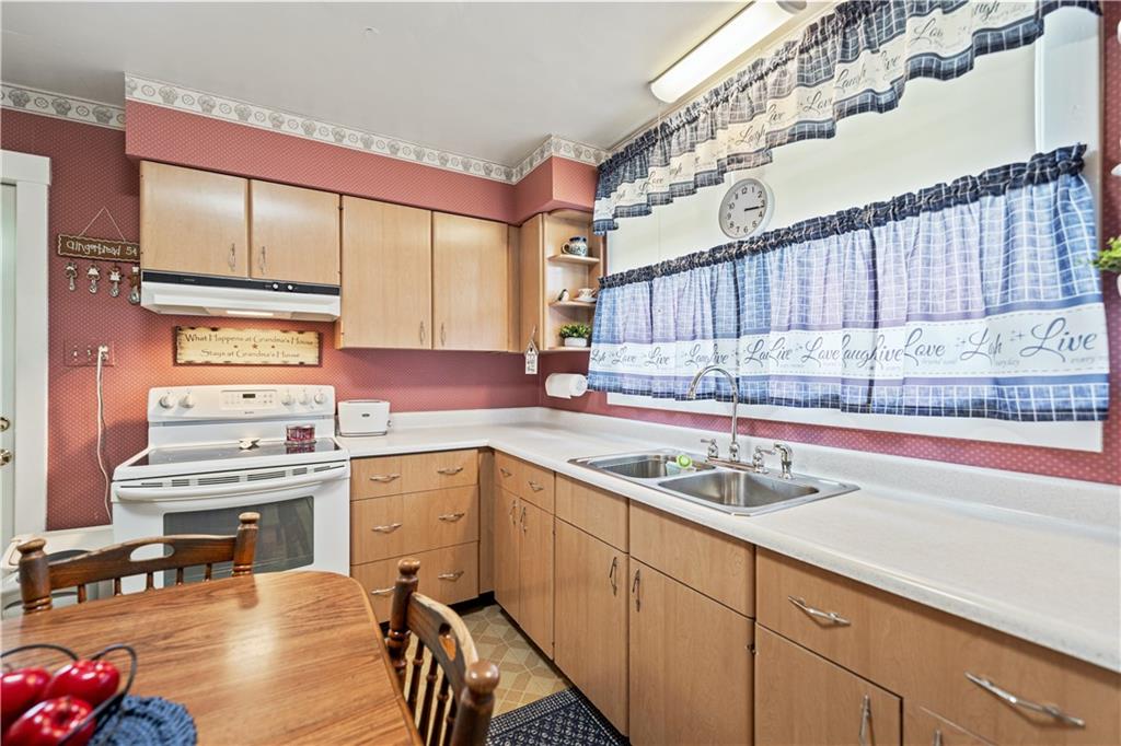 14 Pumpkin Center Road Finleyville, PA 15332 - Photo 6 of 34 a kitchen with a sink stove and cabinets