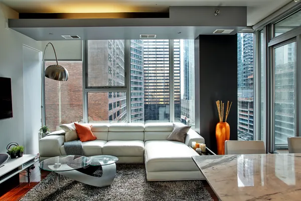 a living room with furniture and a large window