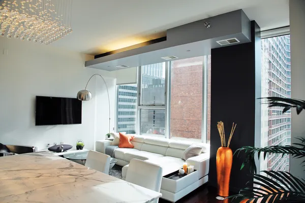 a bedroom with furniture and a flat screen tv