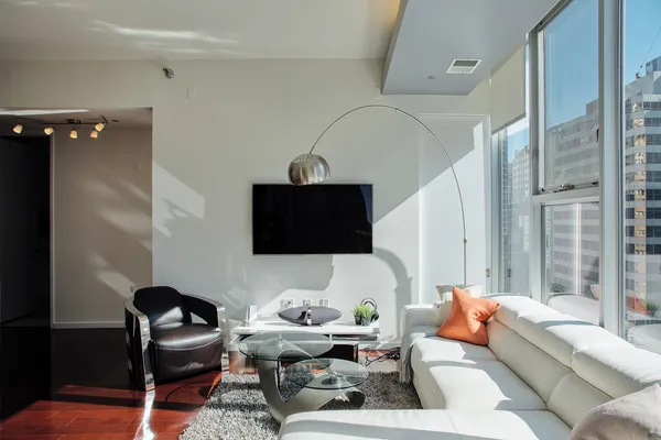 a living room with furniture and a flat screen tv