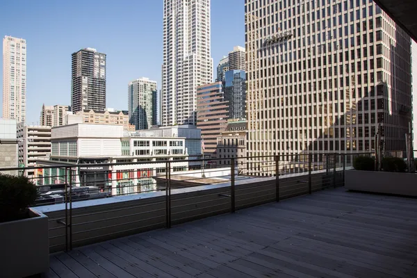 a view of a balcony with wooden floor