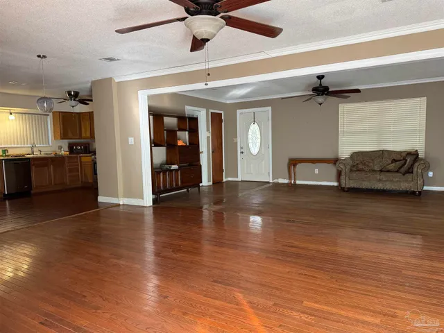 a view of an entryway with wooden floor