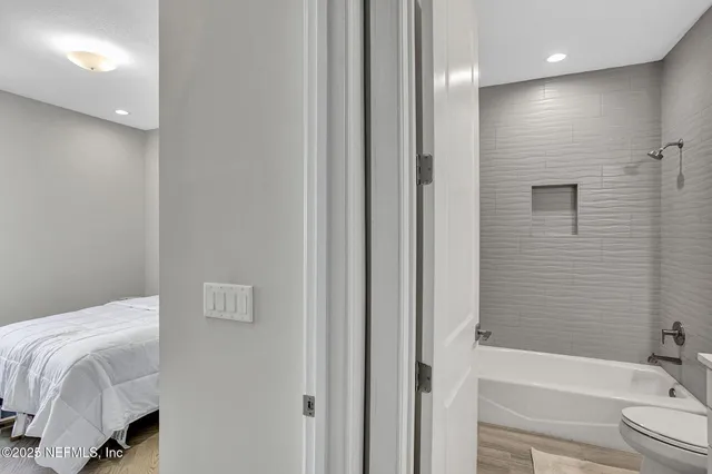 a bathroom with a bathtub and a sink